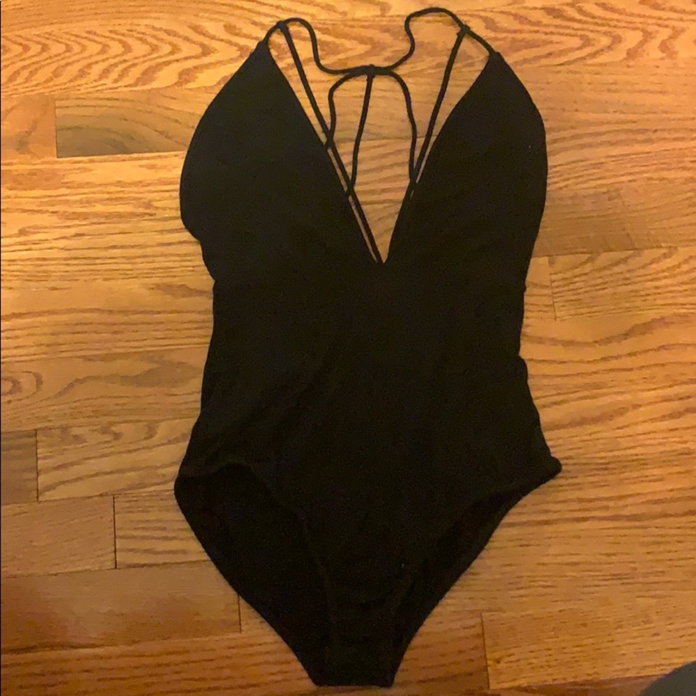 Strappy black bodysuit out from under